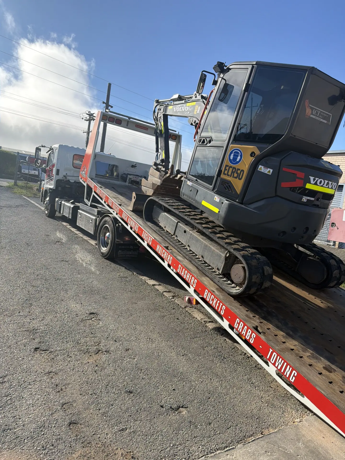 Excavator loaded on the flatbed for delivery